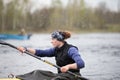 Female athlete engaged in rowing.Girl in a sports boat with oars