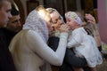 Belarus, Gomel, 25 March. 2018. The Prudhkovsky Church.Mother and godmother on a baptismal rite.Parents with a child in the church