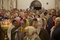 Celebration of Orthodox Easter.Crowd of people in church.Believers