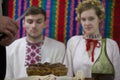 Reconstruction of an ethnic old Belarusian wedding.Wedding cake and brandy on the background of