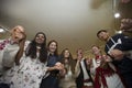 Reconstruction of an ethnic old Belarusian wedding.Multilingual group of people dancing