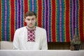 Reconstruction of an ethnic old Belarusian wedding.Ukrainian man in embroidery with a bottle of