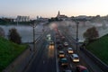 Belarus, Grodno July 15, 2022: The movement of cars and public transport on the bridge over the river. Thick morning fog over the