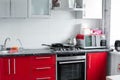 Belarus Minsk 06 12 2019Beautiful modern clean red kitchen in small apartment full shot