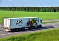 SCANIA truck ÃÂ«APS - Transport Logistic SolutionÃÂ» with Semi-trailer driving along highway. Goods