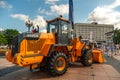 Belarus, Minsk, June 14, 2022: Open-air exhibition of modern wheeled agricultural machinery. New tractors, combines with plow and