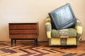 Belarus, Minsk - June 03, 2019:Sony trinitron kv-21m3.The old TV lies in a vintage armchair.Old design in a home.