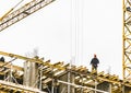 Belarus, Minsk - March 06, 2020: A builder stands on the edge of a building under construction, a dangerous profession Royalty Free Stock Photo