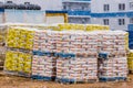 Belarus, Minsk - March 14, 2020: Heap of industrial bags with glue and plaster, building materials storage outdoor at a