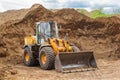 Belarus, Minsk - May 28, 2020: Bulldozer or tractor industrial heavy machine at a construction site against the background of a