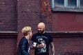 Belarus, Minsk, may 17, 2015, Oktyabrskaya street, biker festival. couple of bikers drinking coffee near the city