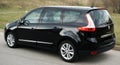 Belarus, Minsk-October 6, 2019:Black car Renault Grand Scenic stands on the road,side view. Photographing a modern car in the park