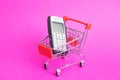 Belarus, Novopolotsk - 16 february, 2022: Old push-button telephone Nokia in a shopping cart Royalty Free Stock Photo