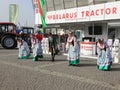 Belarus Tractor stand - dancers in popular costumes from Belarus