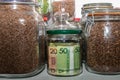 Belarusian paper money in a glass jar among other jars with cereals and dried fruits. Keeping money in a glass jar.