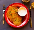 Belarusian traditional potato pancakes with sour cream