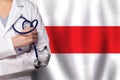 Belarussian medicine and healthcare concept. Doctor close up against flag of Belarus background