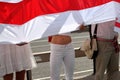 Belarussian protesters holding national flag