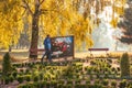 Belaya Tserkov, Ukraine, October 17, 2019: Two men carry painting in the morning in the autumn park
