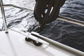 Belaying rope, cleat hitch, knot tying detail on a sailboat Royalty Free Stock Photo