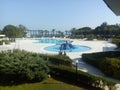 Belek, Turkey, a hotel pool with attractions. Palm trees and blue sky.