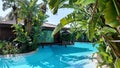 Belek, Turkey - May 2021: Hut on a tropical island. Cottage with pool in the jungle. Close-up. Tropical plants around the cottage Royalty Free Stock Photo