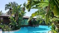 Belek, Turkey - May 2021: Hut on a tropical island. Cottage with pool in the jungle. Close-up. Tropical plants around the cottage Royalty Free Stock Photo