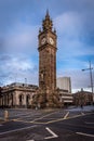 BELFAST, NORTHERN IRELAND, DECEMBER 19, 2018: People passing by Queen's Square where Albert Memorial Clock Tower is situated.