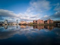 Belfast, Northern Ireland, Houses near Lagan River. Buildings reflection in water.