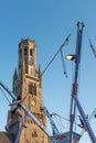 Belfry tower and fairground attraction in the historical city of Bruges in Belgium Royalty Free Stock Photo