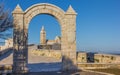 Belfry of the Trani cathedral seen through an arch