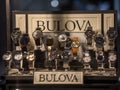 Bulova logo in front watches on wristwatches and chronographs for sale in a jewelry.