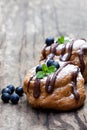Belgian chocolate choux buns stuffed with blueberry and cream o