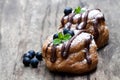 Belgian chocolate choux buns stuffed with blueberry and cream o