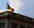 Belgian flag above a historic building in Brussels in backlit Royalty Free Stock Photo