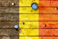 Belgian flag painted on old weathered boards Royalty Free Stock Photo