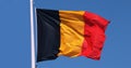 Belgian Flag Waving in the Wind against blue sky Royalty Free Stock Photo