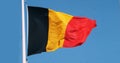 Belgian Flag Waving in the Wind against blue sky Royalty Free Stock Photo