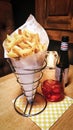 Belgian fries cone with fruity beer. Typical Belgian food.
