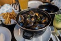 Steamed mussels, french fries and beer Royalty Free Stock Photo