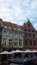 Belgian town. Man working on roof