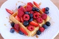 Belgian waffle with berries and syrup Royalty Free Stock Photo