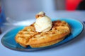 Belgian waffle with ice cream topping Royalty Free Stock Photo