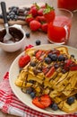 Belgian waffles with blueberries, strawberries Royalty Free Stock Photo