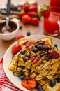 Belgian waffles with blueberries, strawberries Royalty Free Stock Photo