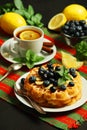 Belgian waffles with blueberry and a cup of tea with lemon Royalty Free Stock Photo