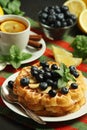 Belgian waffles with blueberry and a cup of tea with lemon Royalty Free Stock Photo