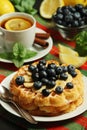 Belgian waffles with blueberry and a cup of tea with lemon Royalty Free Stock Photo