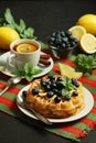 Belgian waffles with blueberry and a cup of tea with lemon Royalty Free Stock Photo
