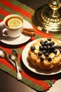 Belgian waffles with blueberry and a cup of tea with lemon Royalty Free Stock Photo